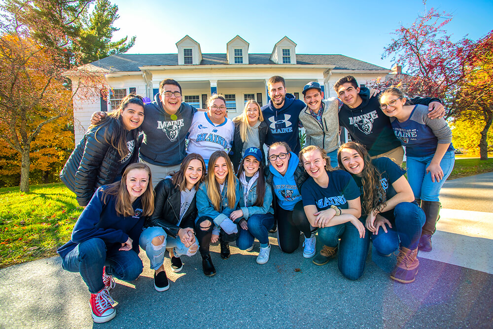 Team Maine in front of Heritage House