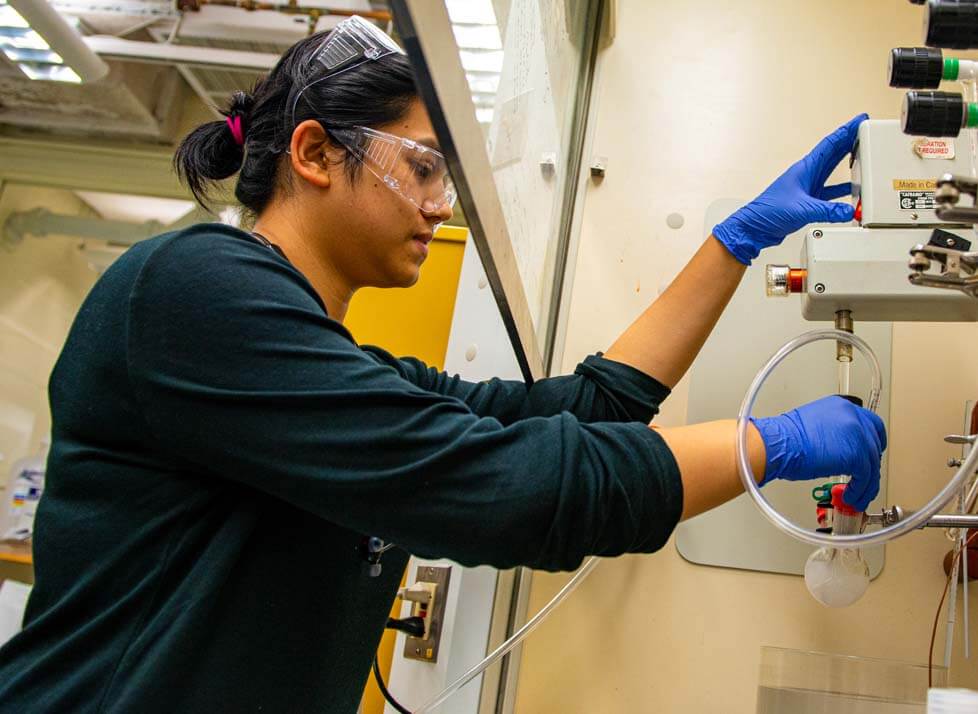 A photo of a person in a chemistry lab