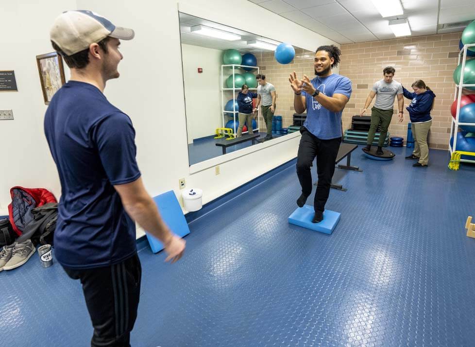 A photo of athletic training students in a gym