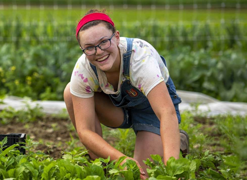 A photo of a person in a garden