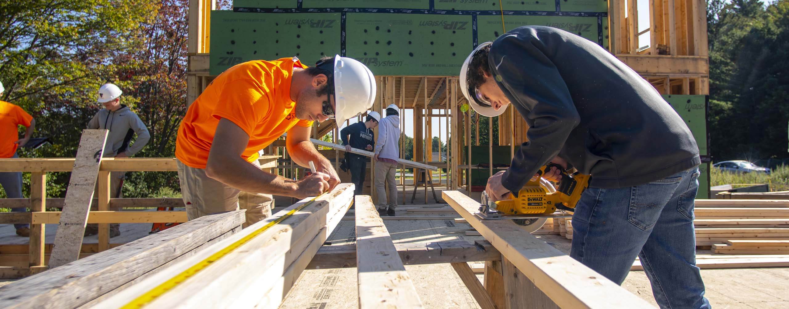 A photo of two engineers working on a construction site
