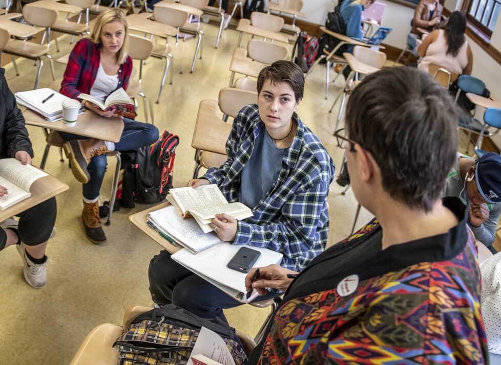 A photo of an instructor and students in a class