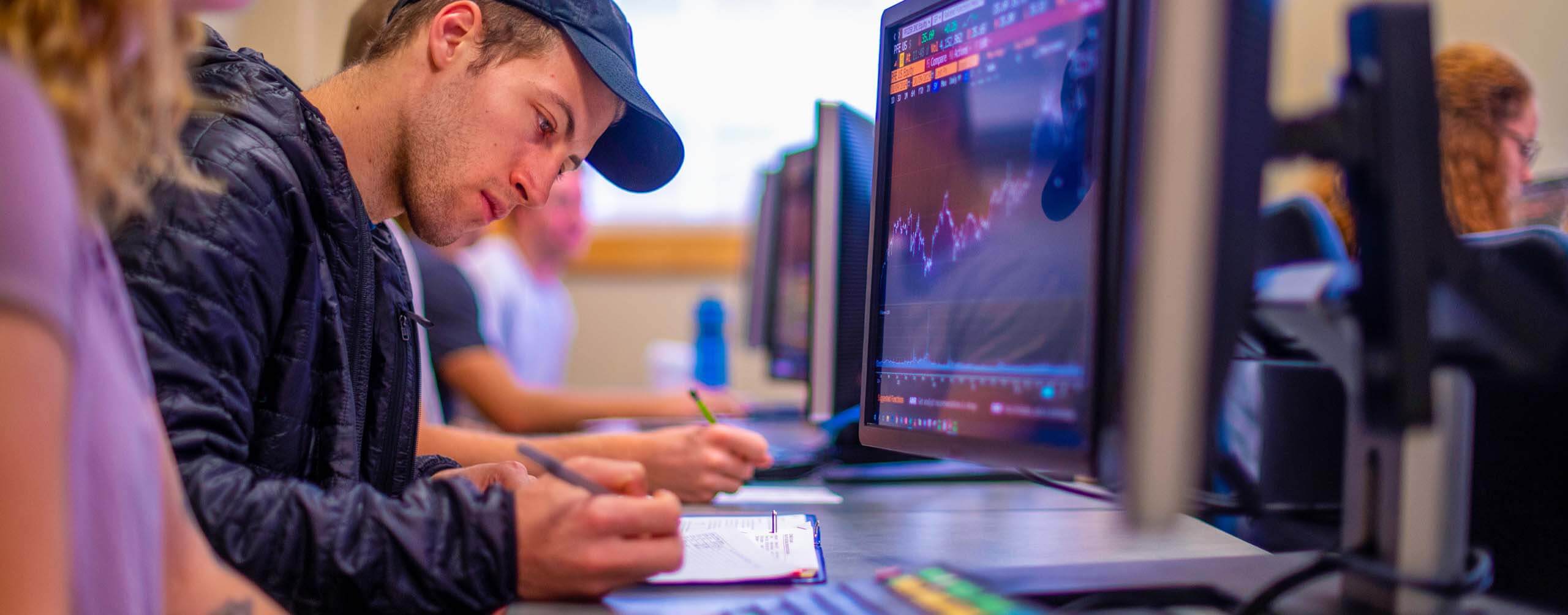 A photo of financial economics students in a lab class