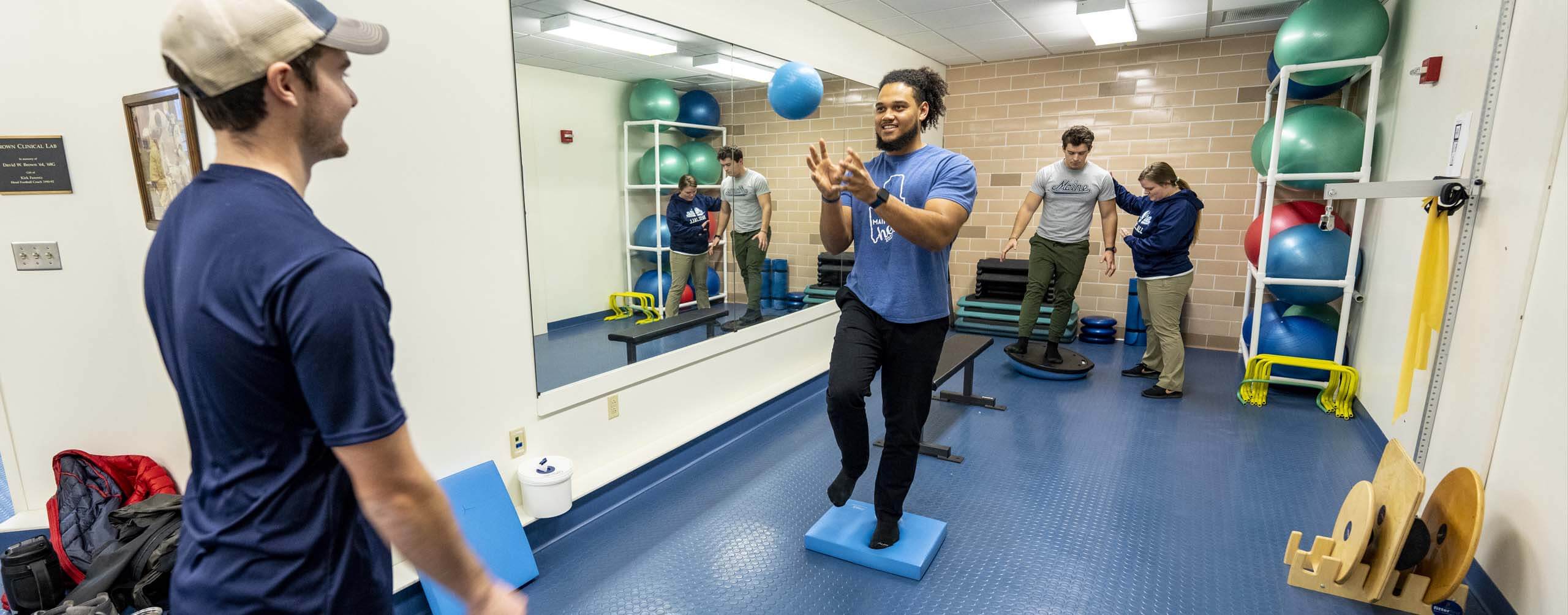 A photo of athletic training students in a gym