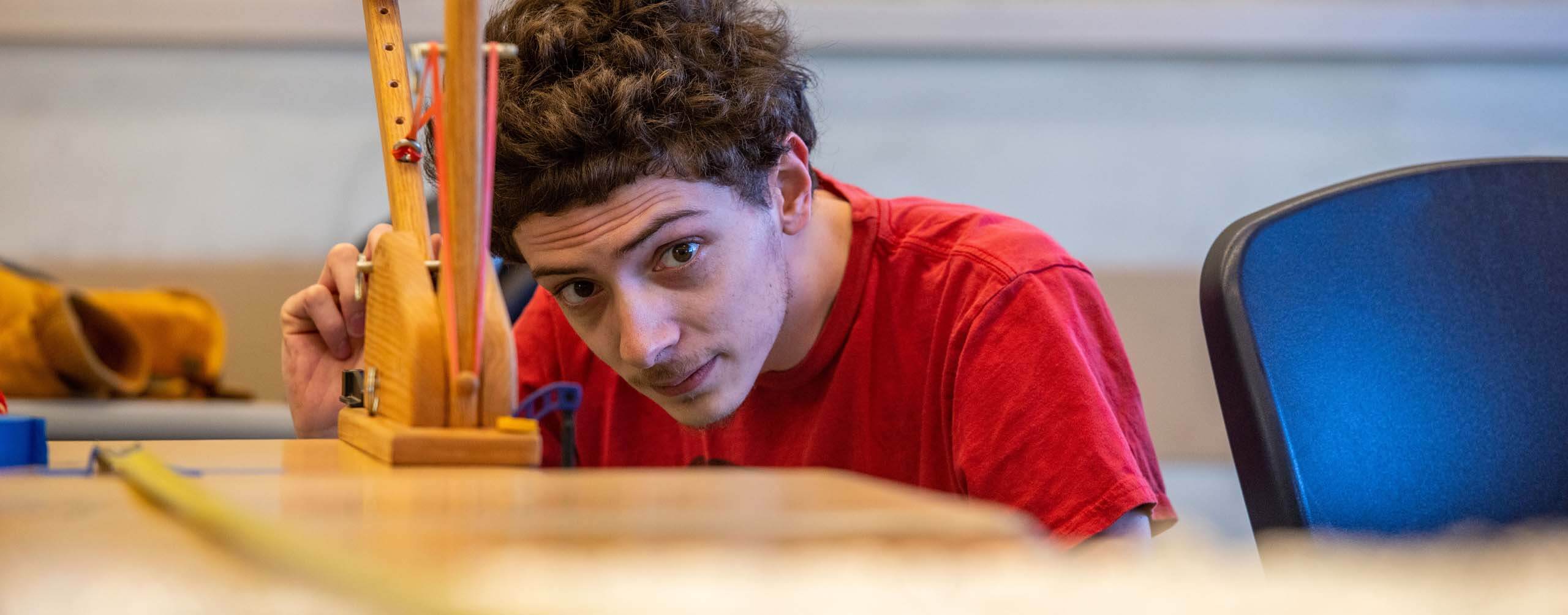 A photo of an engineering student in a lab class