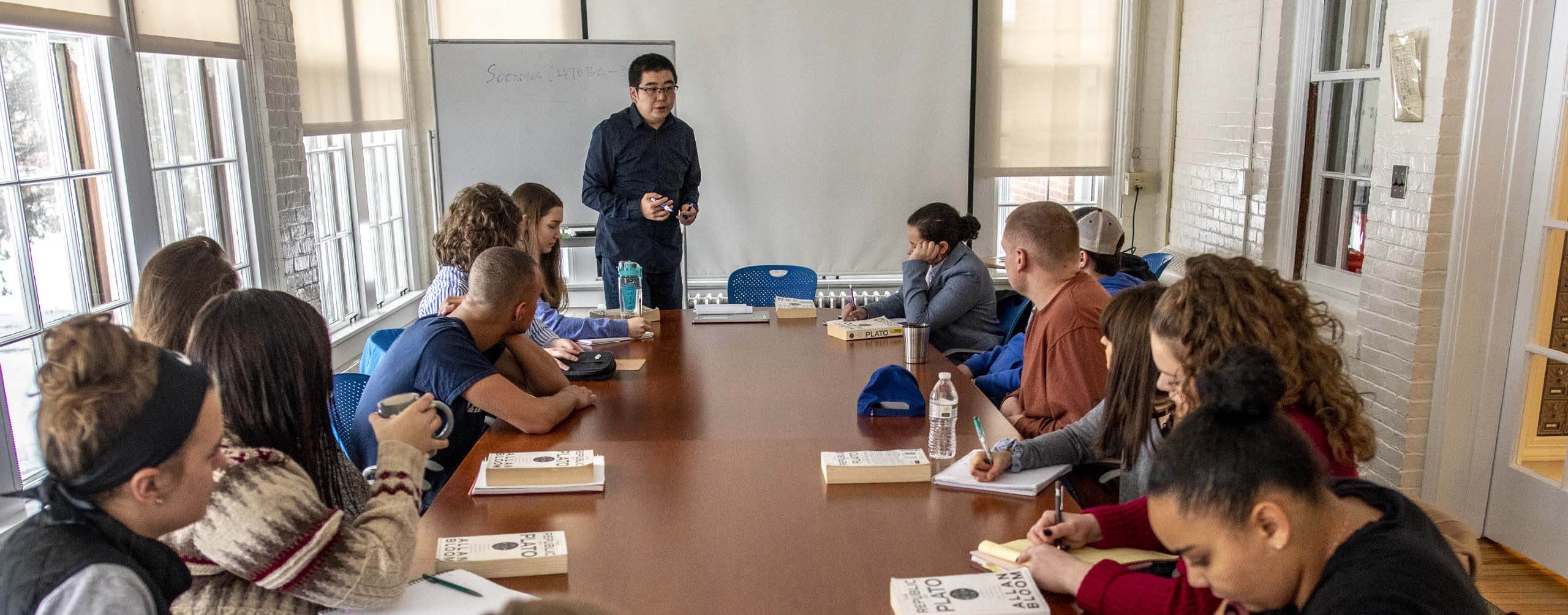 A class of students sitting around a table
