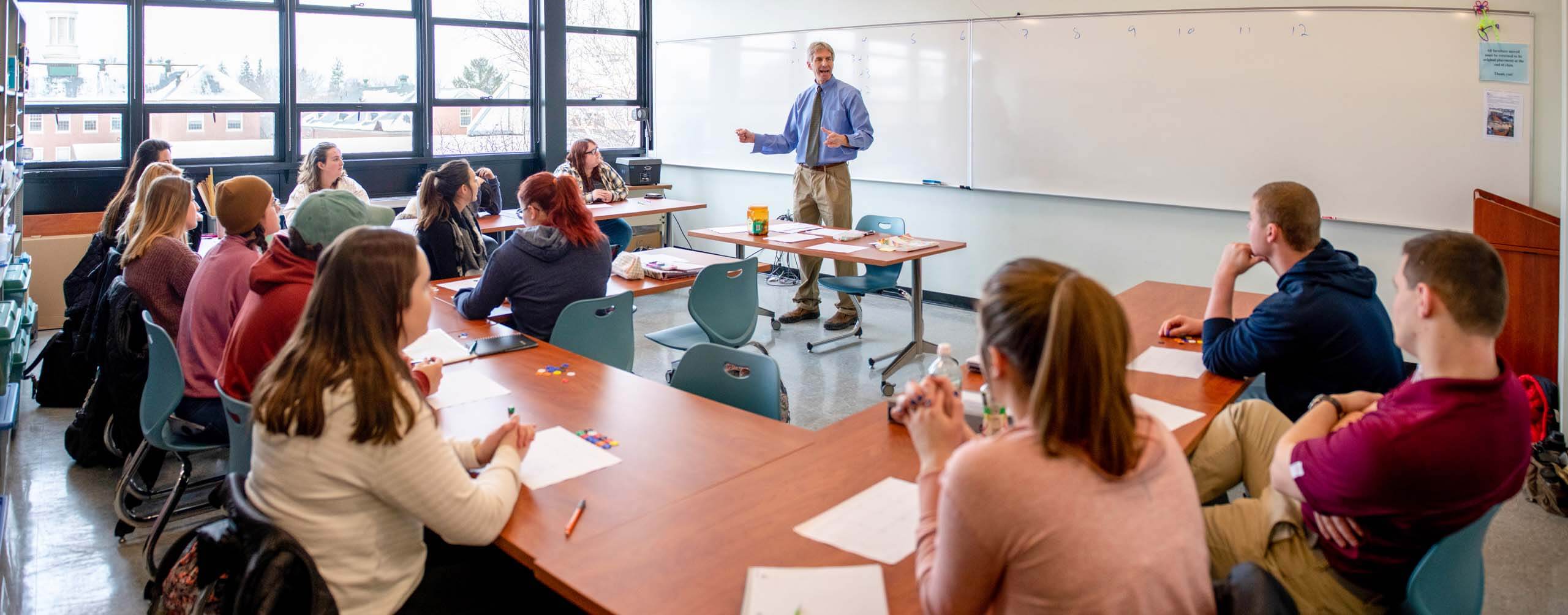 A photo of a class of students listening to an instructor