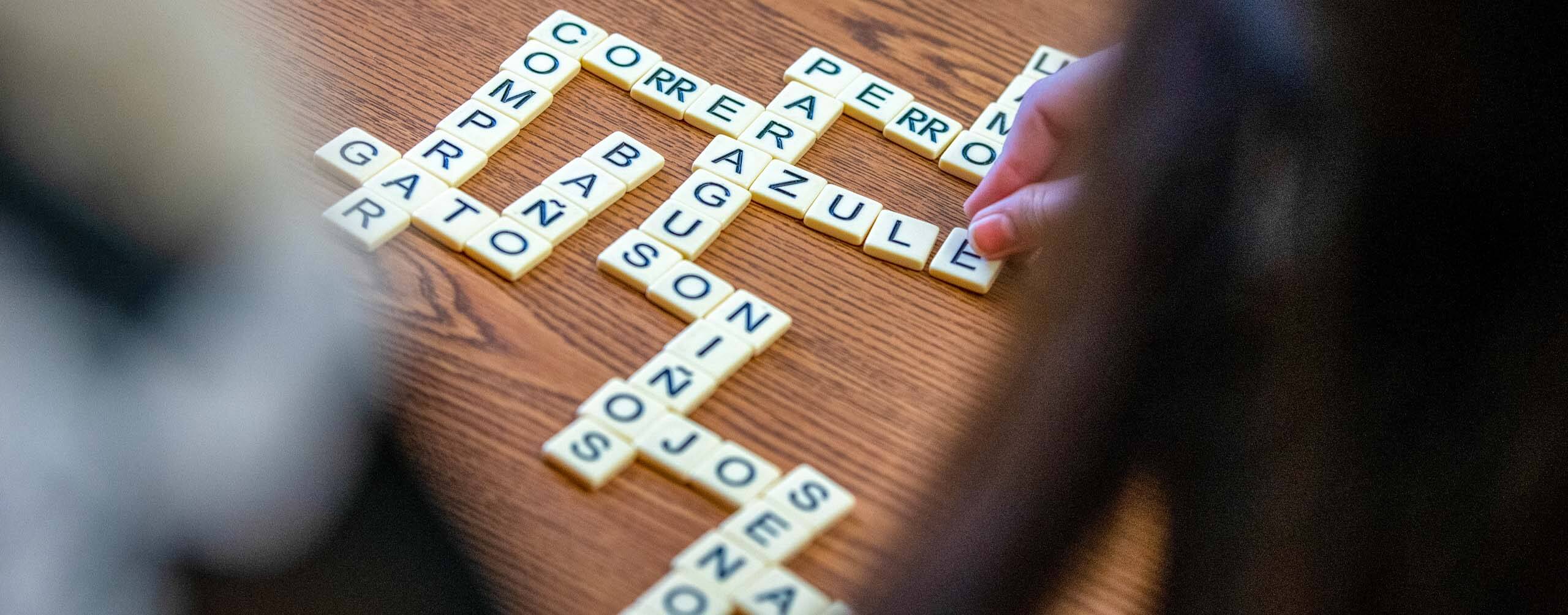 A photo of Spanish words spelled out with letter tiles