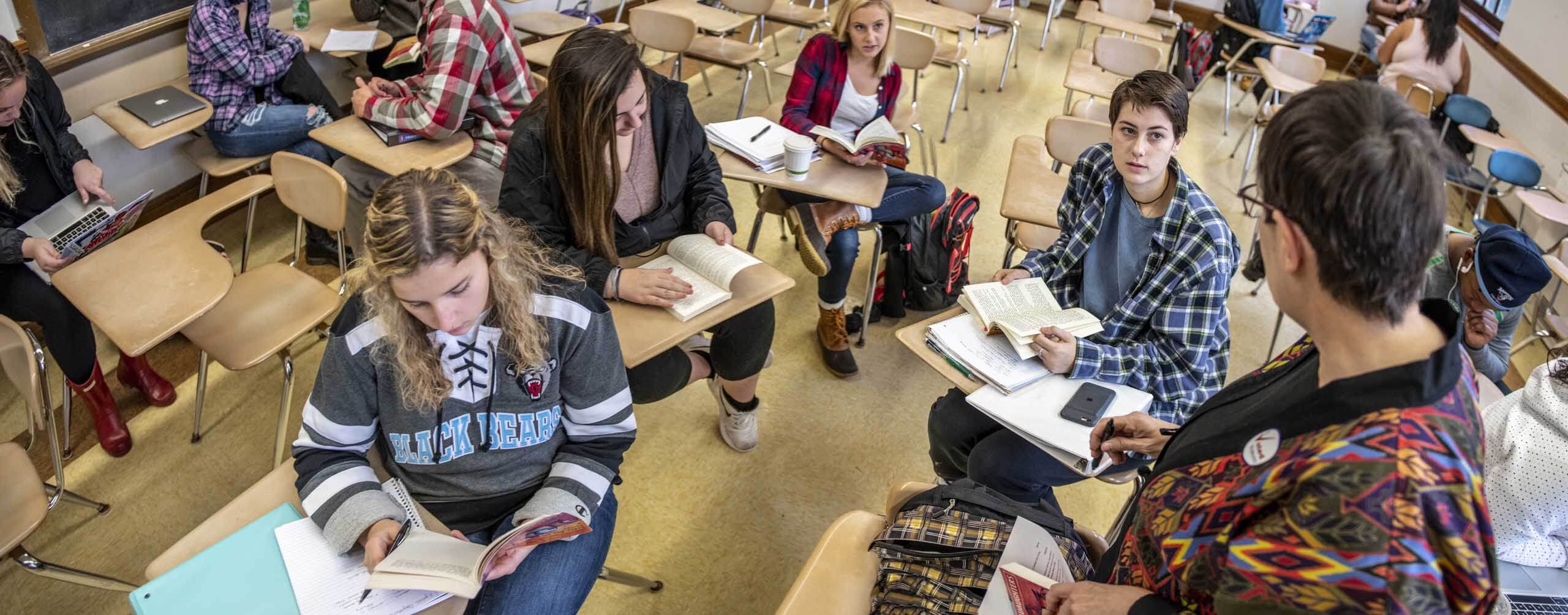 A photo of an instructor and students in a class