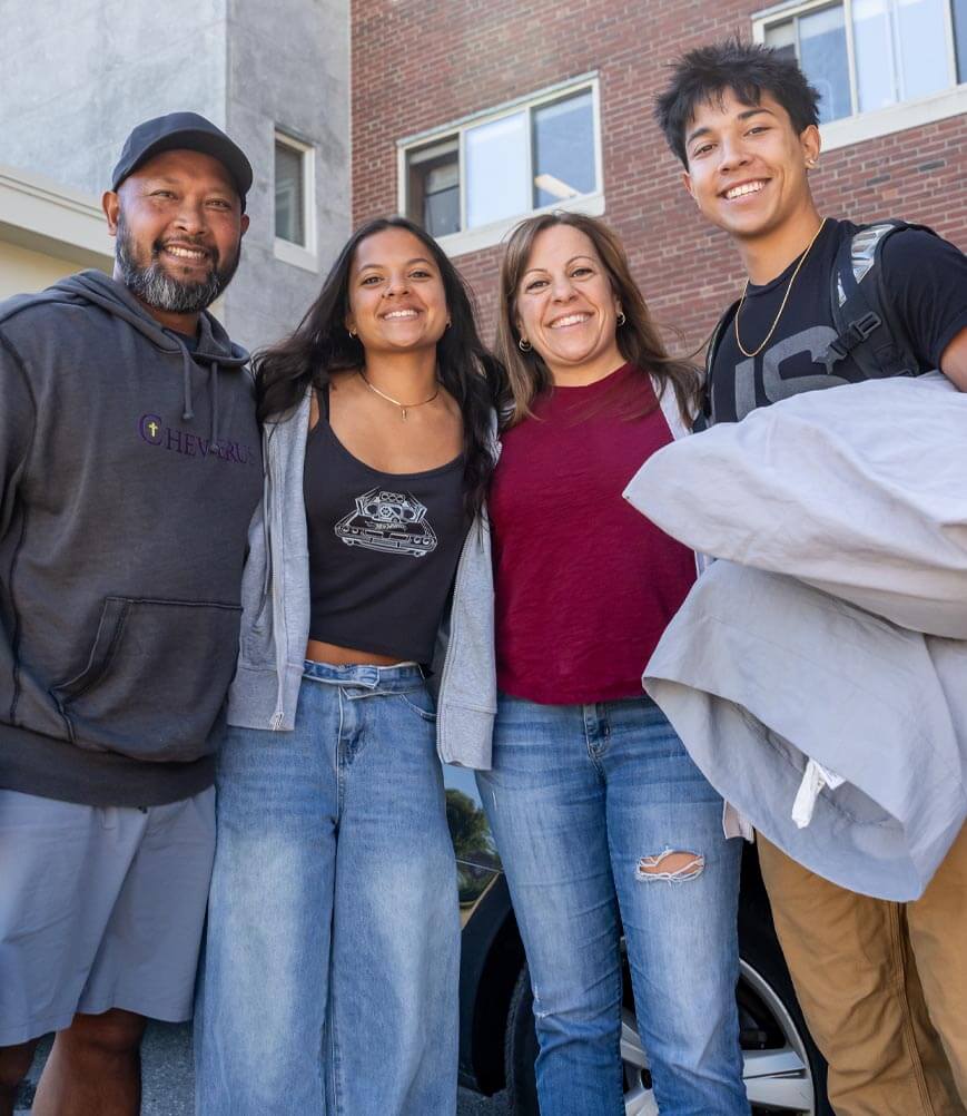 A photo of a student and their family on move-in day